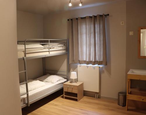 Dviaukštė lova arba lovos apgyvendinimo įstaigoje Vakantiehuis De Lounge
