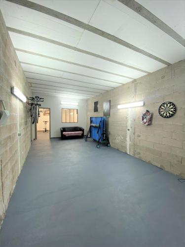 an empty room with a white brick wall at Tres belle villa neuve vue mer avec piscine chauffee in Sainte-Lucie de Porto-Vecchio