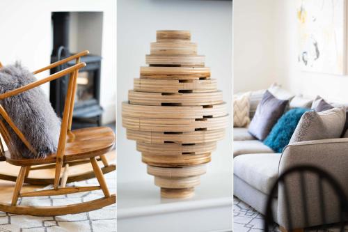 a living room with a chair and a stack of wood at St Hilary in St Ives