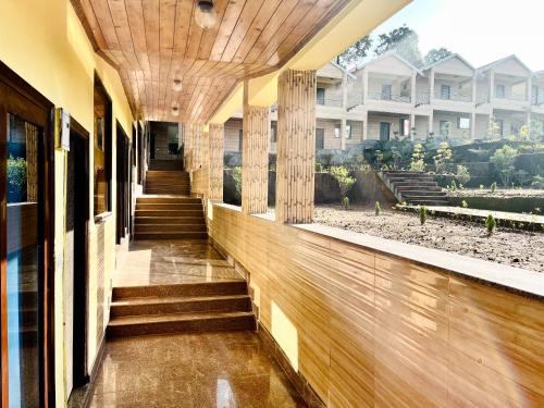 a hallway of a house with a wooden ceiling at NEELGAGAN RESORT in Chaukori
