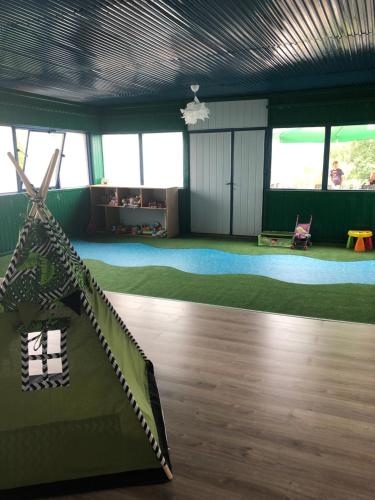a room with a room with a table and a room with a room at Willa Amelia in Solina