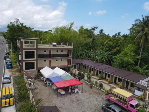an overhead view of a building with a tent in front at Red Palm Inn balcony room with Netflix in Baybay