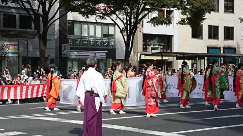 a group of people walking down a street in a parade at Toyoko Inn Kyoto Shijo-karasuma in Kyoto