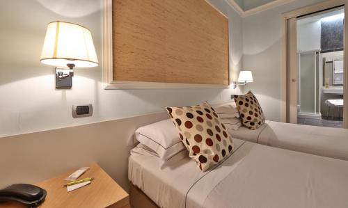 Ένα ή περισσότερα κρεβάτια σε δωμάτιο στο Hotel San Marco & Formula Club