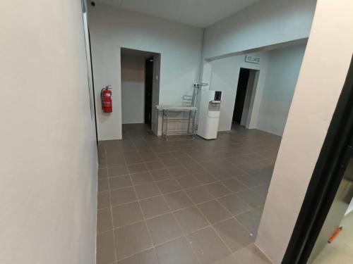 an empty hallway with a fire hydrant in a room at D LAYARAN KUANTAN LPT Exit 833 in Kuantan