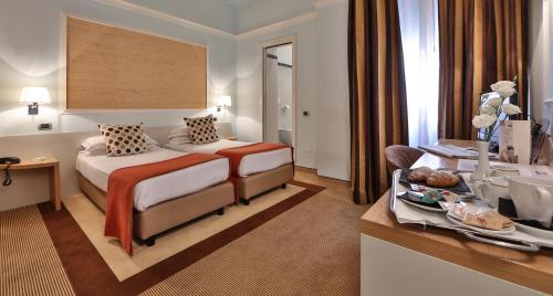 Ένα ή περισσότερα κρεβάτια σε δωμάτιο στο Hotel San Marco & Formula Club