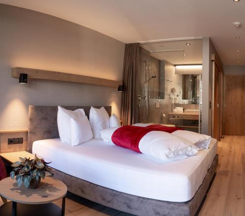 Postel nebo postele na pokoji v ubytování Hotel Post
