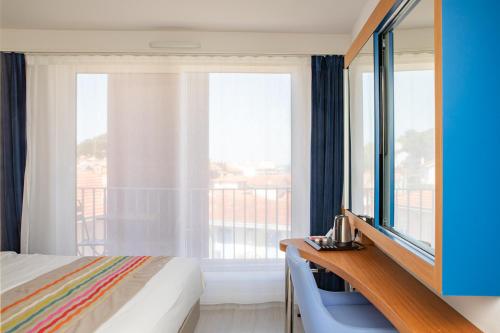 Cama o camas de una habitación en Best Western Arcachon Le Port