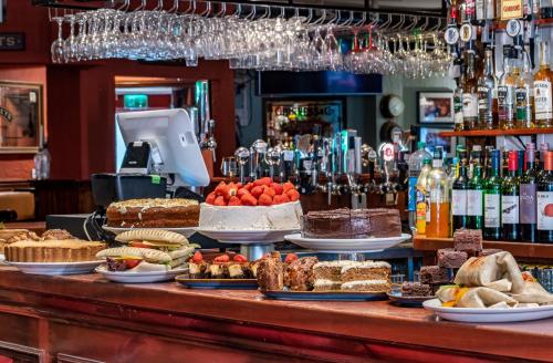 a bar with a bunch of food on a table at Foley's Guesthouse & Self Catering Holiday Homes in Kenmare