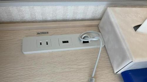 an electronic device with a cord plugged into a box at Toyoko Inn Aioi eki Shinkansen guchi in Aioi