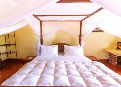 Un pat sau paturi într-o cameră la Crater Rim View