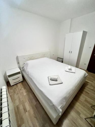 Postel nebo postele na pokoji v ubytování Apartments Family