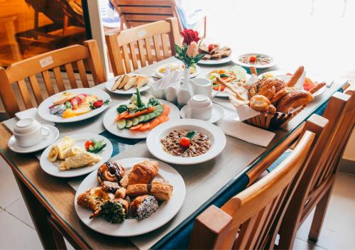 a long table with plates of food on it at Retal View North Coast Aqua Park in El Alamein