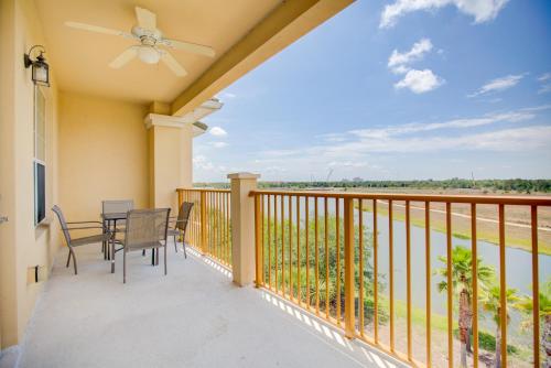 a patio with a table and chairs on a balcony at Top-Floor Luxurious LAKEVIEW Condo in Orlando