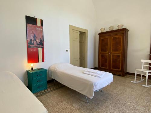 Un pat sau paturi într-o cameră la Masseria Santissimo - Country Experience