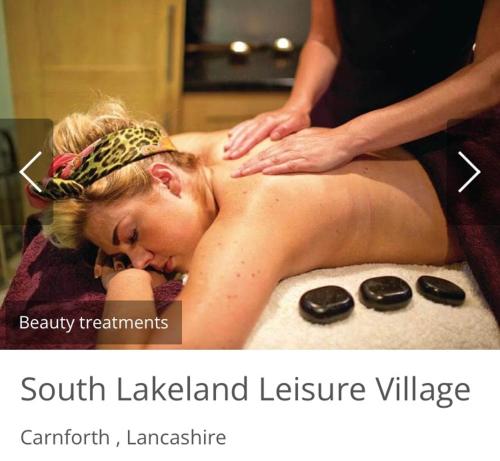 a woman getting a massage in a bath tub at Dot's Place 1 in Carnforth
