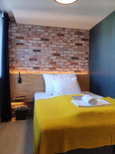 Katil atau katil-katil dalam bilik di Kragerø Hotell