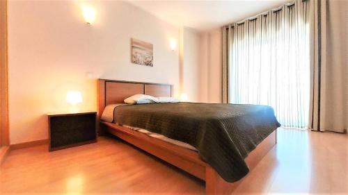 Кровать или кровати в номере Apartamentos Turisticos Rocha Tower 4