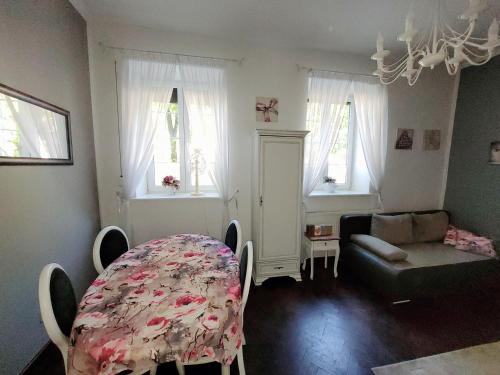 a living room with a table and a couch at Old Town Apartment in Gdańsk