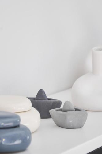 a group of bowls and plates on a counter at 7Rizes Luxury Living in Heraklio Town