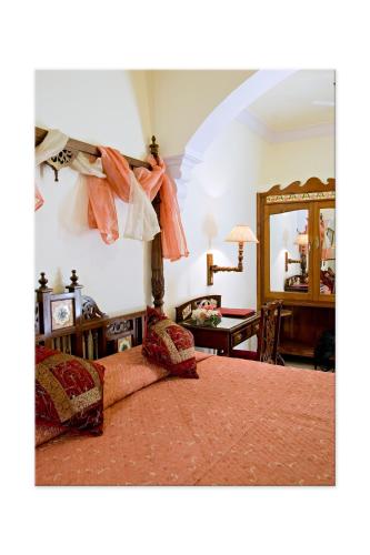 Madhuban - A Heritage Homeにあるベッド