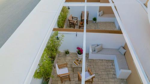 an overhead view of a balcony with chairs and tables at Suncourt Lux Rooms in Laganas