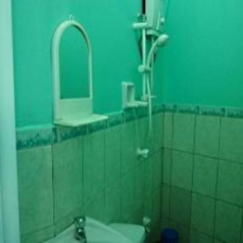 a bathroom with a sink and a mirror at GV Hotel - Davao in Davao City
