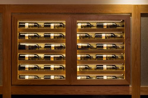 a wooden wine cellar with wine bottles at Prima Park Hotel Jerusalem in Jerusalem
