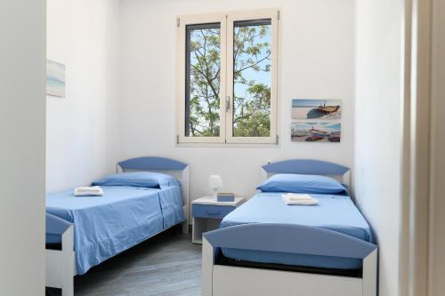 Postel nebo postele na pokoji v ubytování Casa Maiolica
