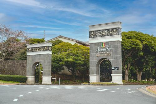 a building with two gates on the side of a street at ArdenHill Resort & Golf in Jeju