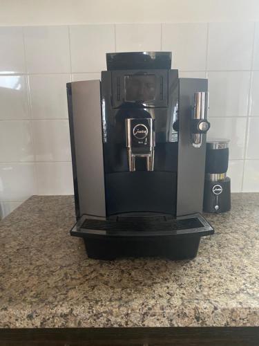 a coffee maker is sitting on a counter at Scheveningen Diamond View Beach and Harbour in Scheveningen