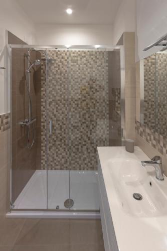 a bathroom with a shower and a sink at Al Duomo B&B in Amantea