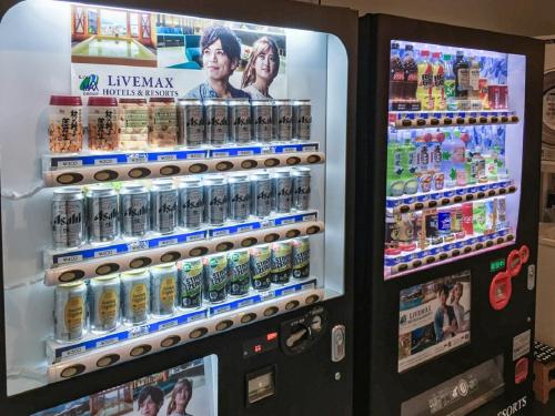 a vending machine filled with lots of drinks at HOTEL LiVEMAX Nagoya Sakuradoriguchi in Nagoya