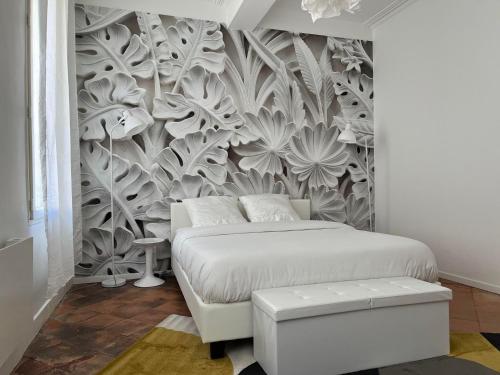 a bedroom with a bed and a wall mural at Convivial PAUL SIBRA-T2-BILLARD- wifi-Vélo in Castelnaudary