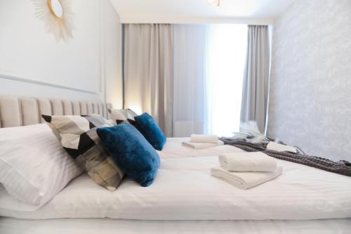 Ένα ή περισσότερα κρεβάτια σε δωμάτιο στο M&K Apartamenty Amber Delux, Gdańsk - Wyspa Sobieszewska