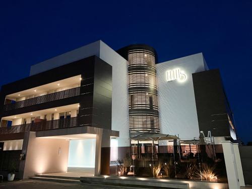 a building with a tall building with a building with at Elitis House - Suite & Spa in Nova Milanese