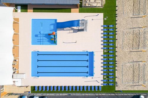 an aerial view of a swimming pool and a building at Hotel Kozerki in Kozerki