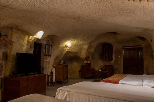Cave Art Hotel Cappadocia 객실 침대