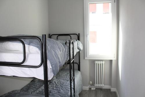 Poschodová posteľ alebo postele v izbe v ubytovaní Appartamento Cevedale11