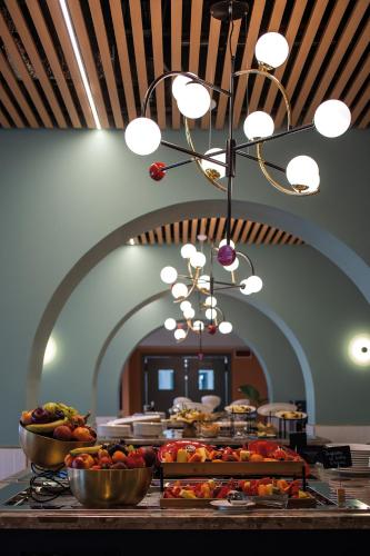 a buffet with many plates of food on a table at Hotel Villa Pamphili Roma in Rome