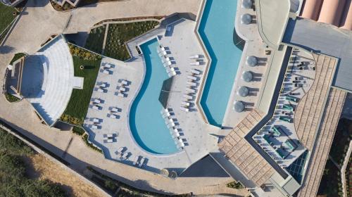 an overhead view of a resort with a pool at Cayo Exclusive Resort & Spa in Elounda