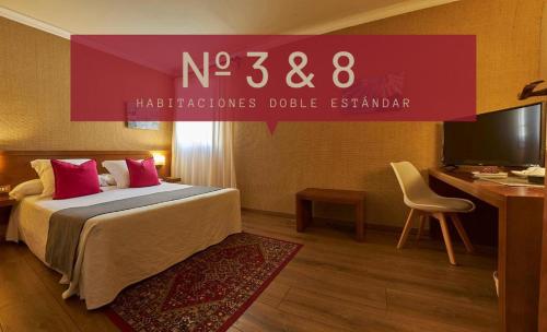 a hotel room with a bed and a desk at Hotel-Hostal Sport in Falset