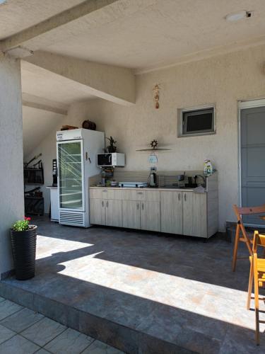 a kitchen with a white refrigerator in a room at Casa Inna Venus in Venus