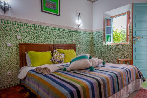 Postel nebo postele na pokoji v ubytování Riad Dar Mamouni