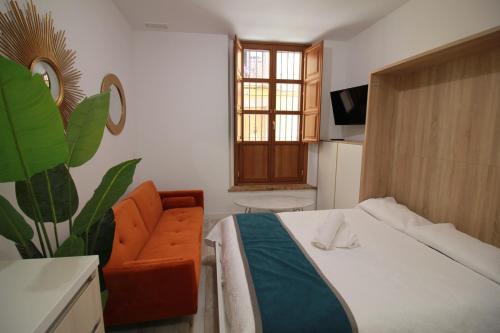Postel nebo postele na pokoji v ubytování GLORIA SUITES