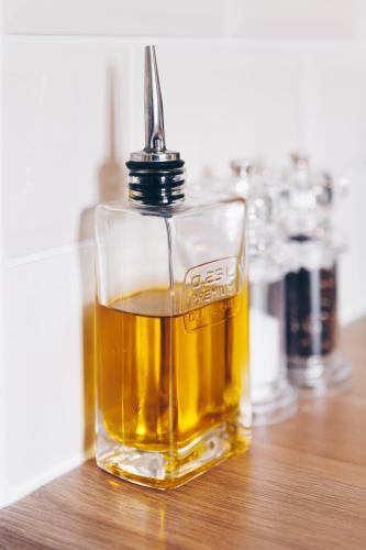 a glass bottle of whiskey sitting on a table at Quay Quarters in Chichester