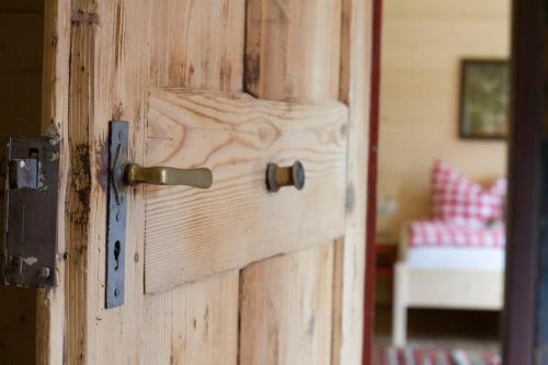 a wooden door with a door knob on it at Ferienhaus Eckstoa in Abtenau