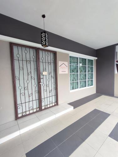 a room with three windows with iron gates at Triple Z Homestay Kuching - LANDED 14 PAX in Kuching