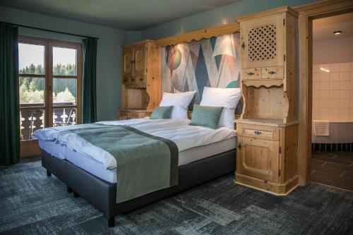 Postel nebo postele na pokoji v ubytování Berghotel Sonnenbichl