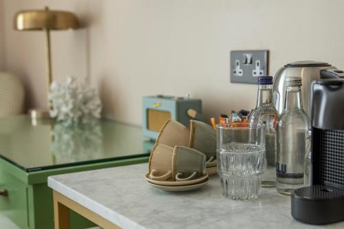 a counter with a pair of shoes and glasses on it at Oyster House in The Mumbles